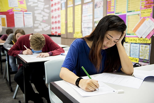 Students doing the exam in classroom