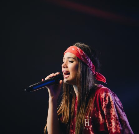 Girl singing - Tips on how to keep your voice healthy.